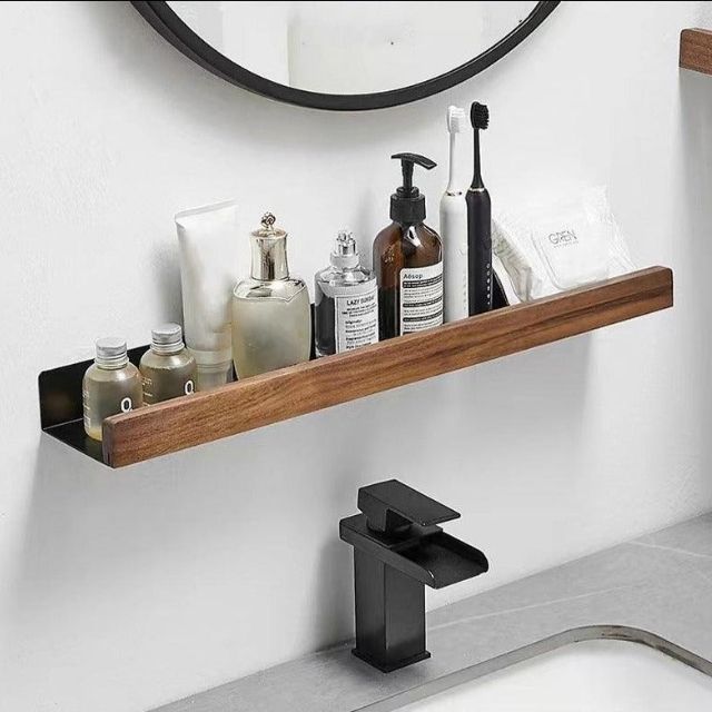 Bathroom wall shelf with raised edge for storage