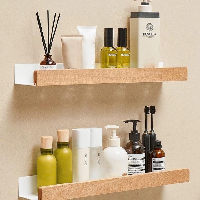 Bathroom wall shelf with raised edge for storage