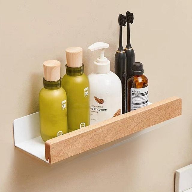 Bathroom wall shelf with raised edge for storage