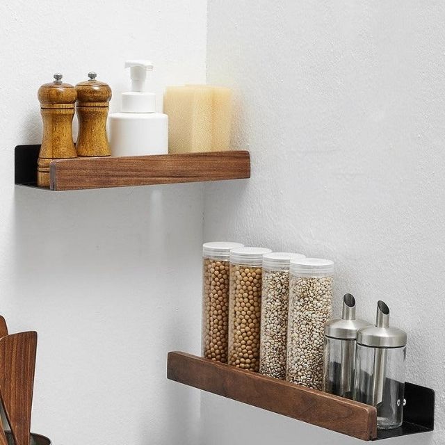 Bathroom wall shelf with raised edge for storage