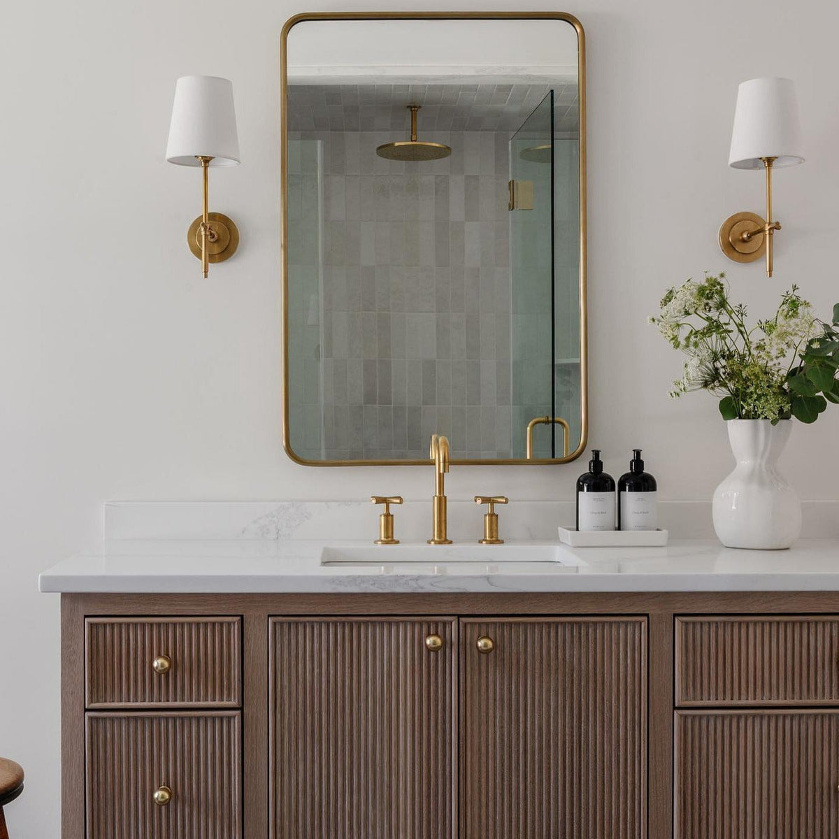 Wall lamp with fabric shade and metal arm